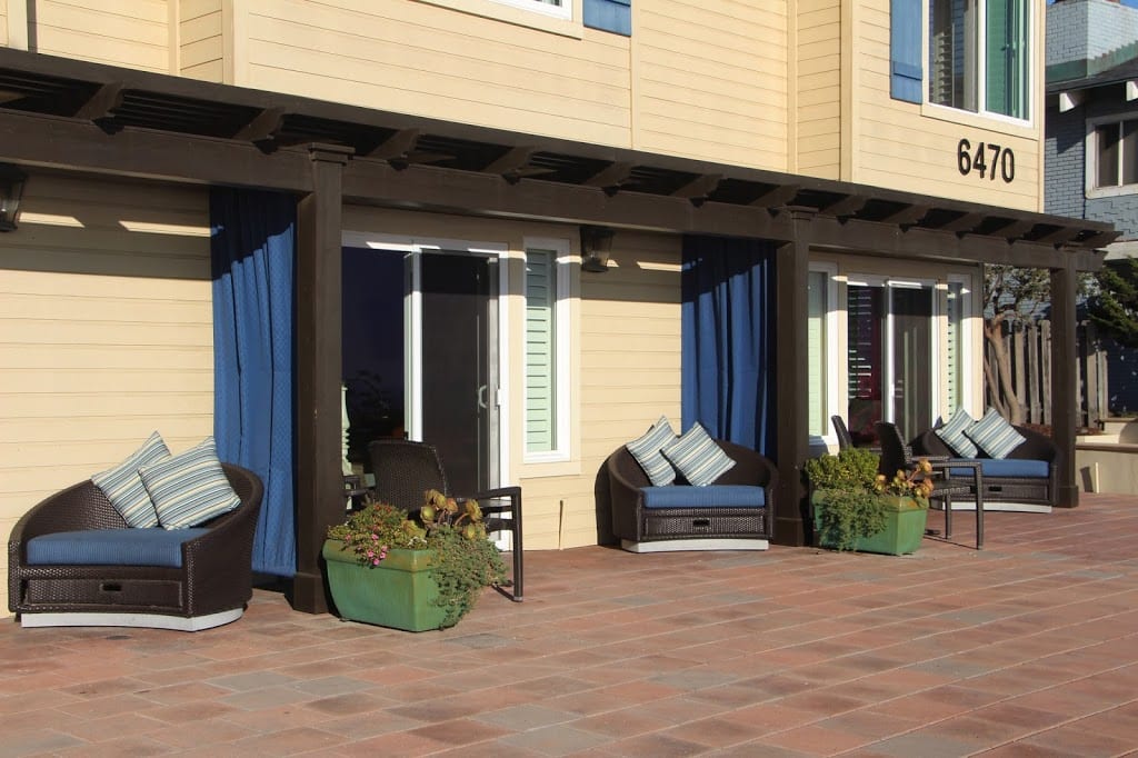 Walk-out patio for the lower level rooms at Blue Dolphin Inn