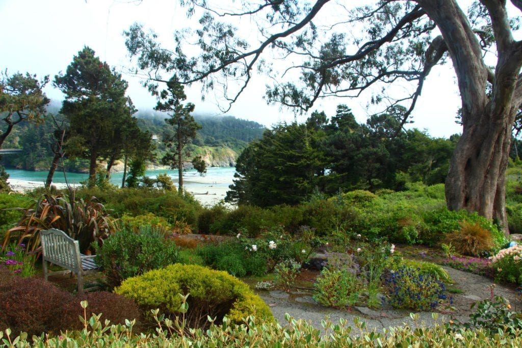Secluded views of the ocean and Big River from the gardens of Alegria Oceanfront Inn & Cottages