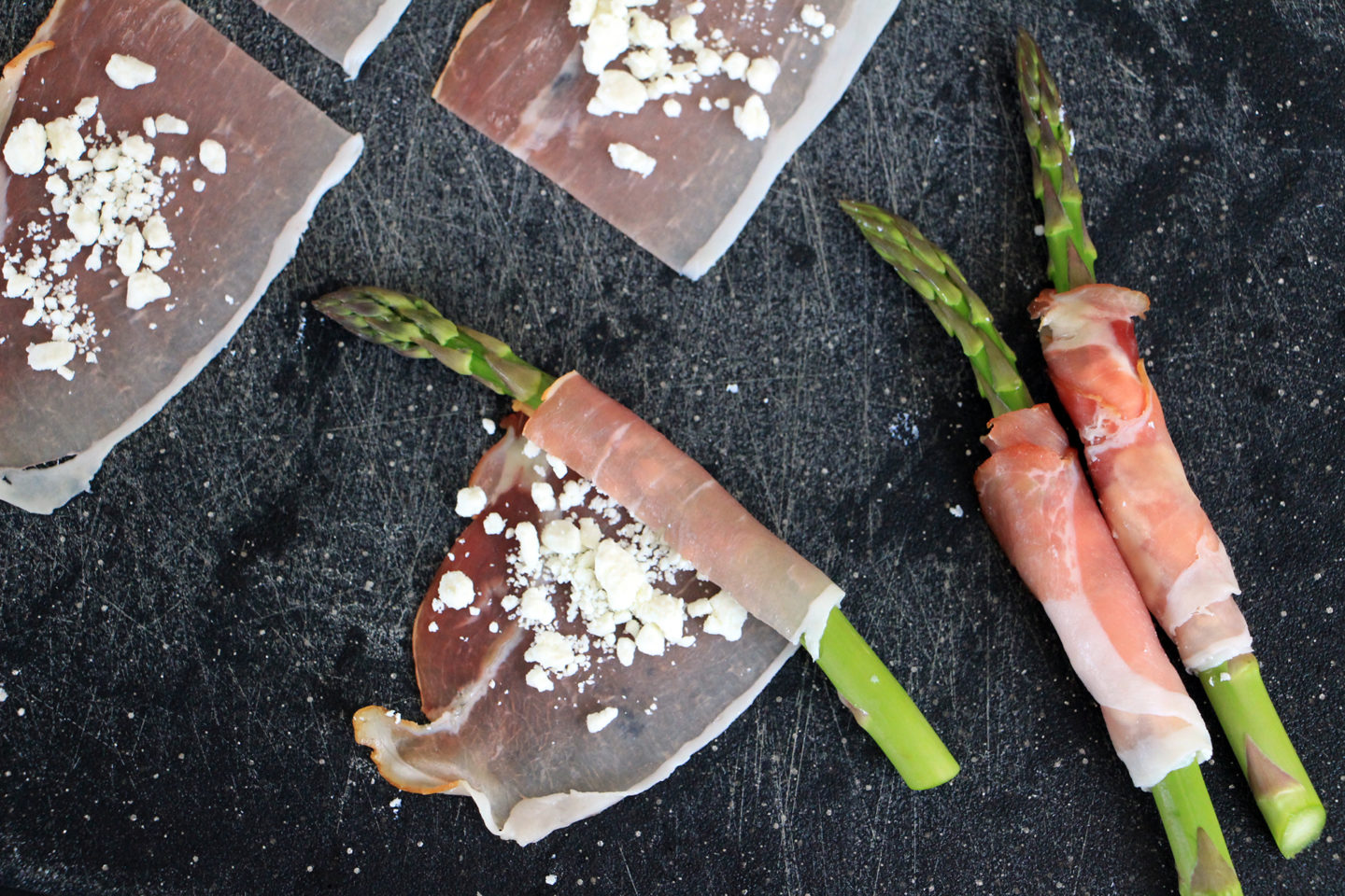 Roll the prosciutto tightly around each asparagus spear