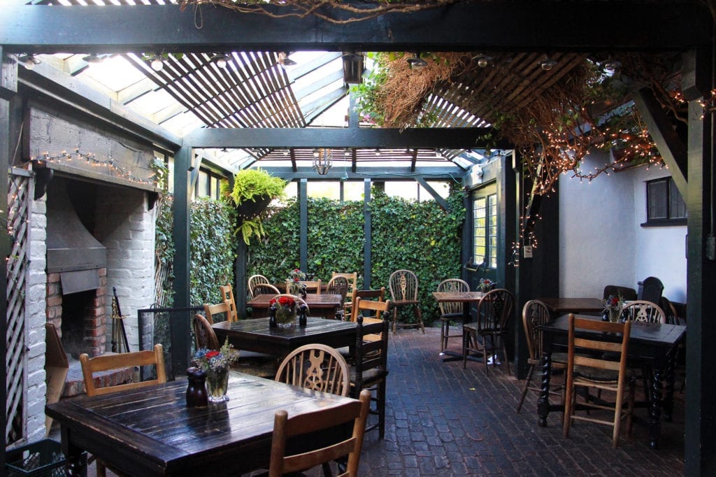 Covered garden patio at The Pelican Inn