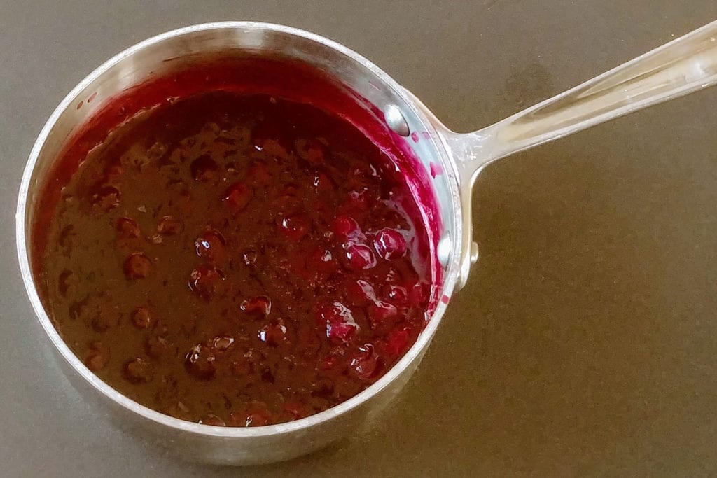 Frozen berries, orange juice, vanilla, orange liqueur, brown sugar, and corn starch brought to a boil makes a thick sauce reminiscent of blueberry jam.
