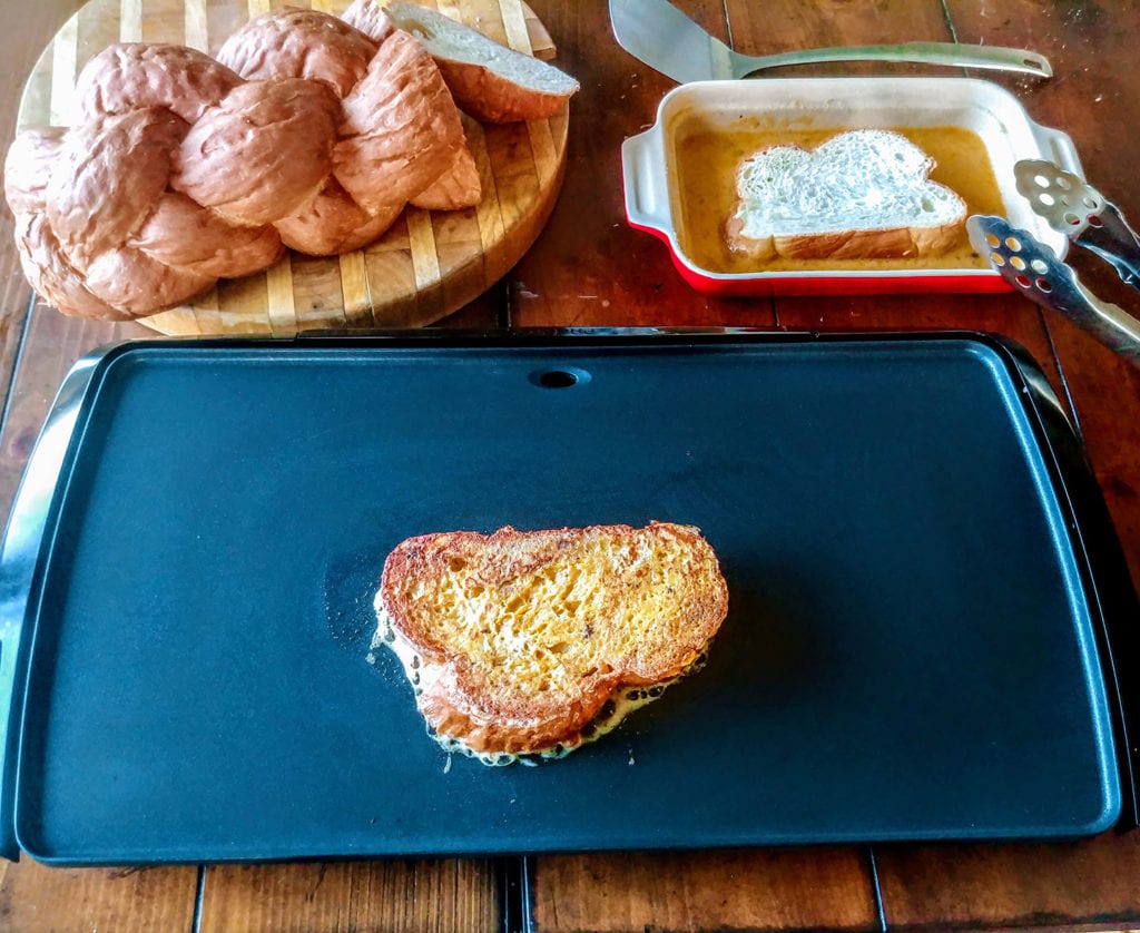 Brown the dipped challah on a griddle or skillet until browned to perfection on each side.