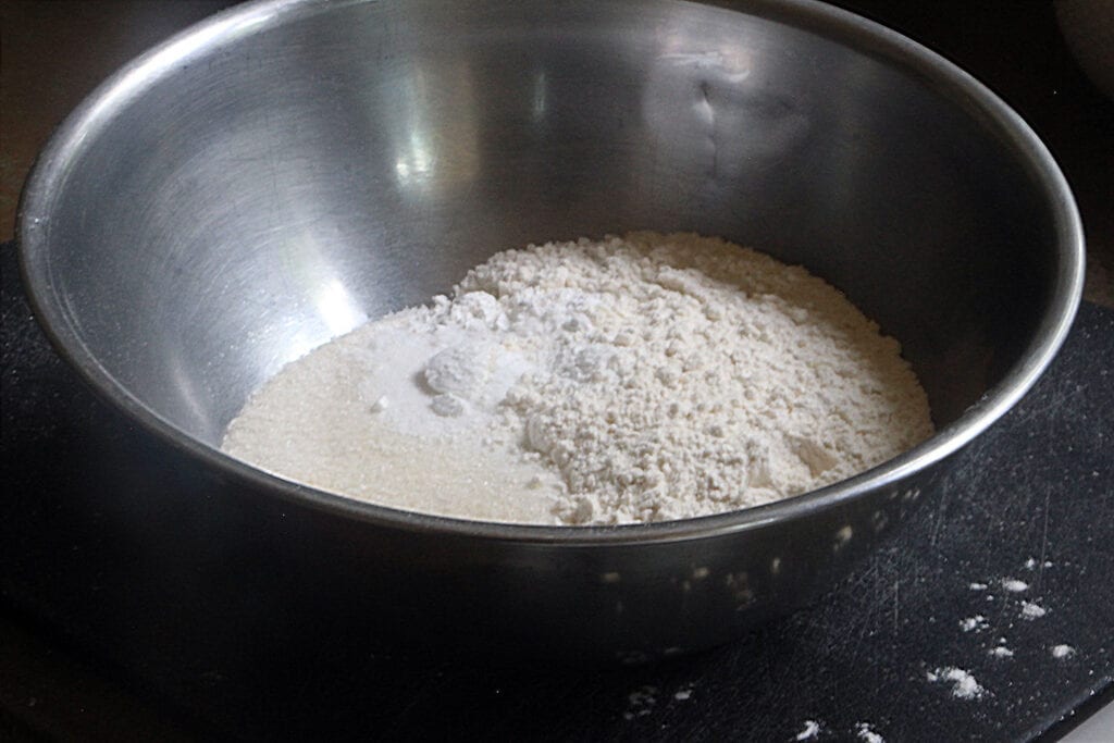 In a large bowl, combine flour, sugar, baking powder and salt