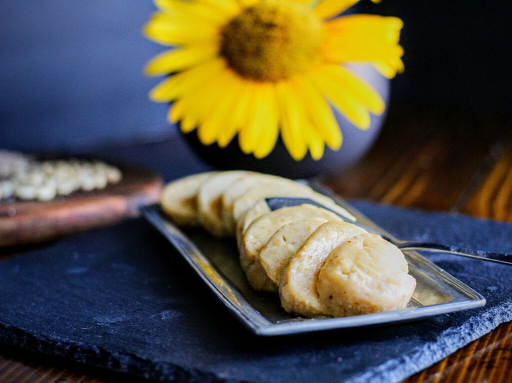 Refrigerate the compound butter and form it into a log, then slice into ¼-inch medallions.