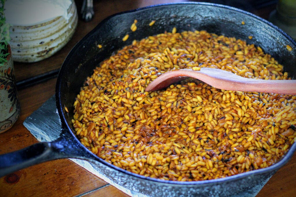 Remove from heat once all liquid is absorbed and rice is opaque and al dente.