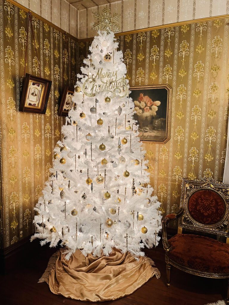 A white Christmas tree at Gingerbread Mansion Inn