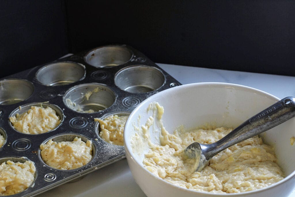 Scoop batter into lined or well-greased muffin tins.