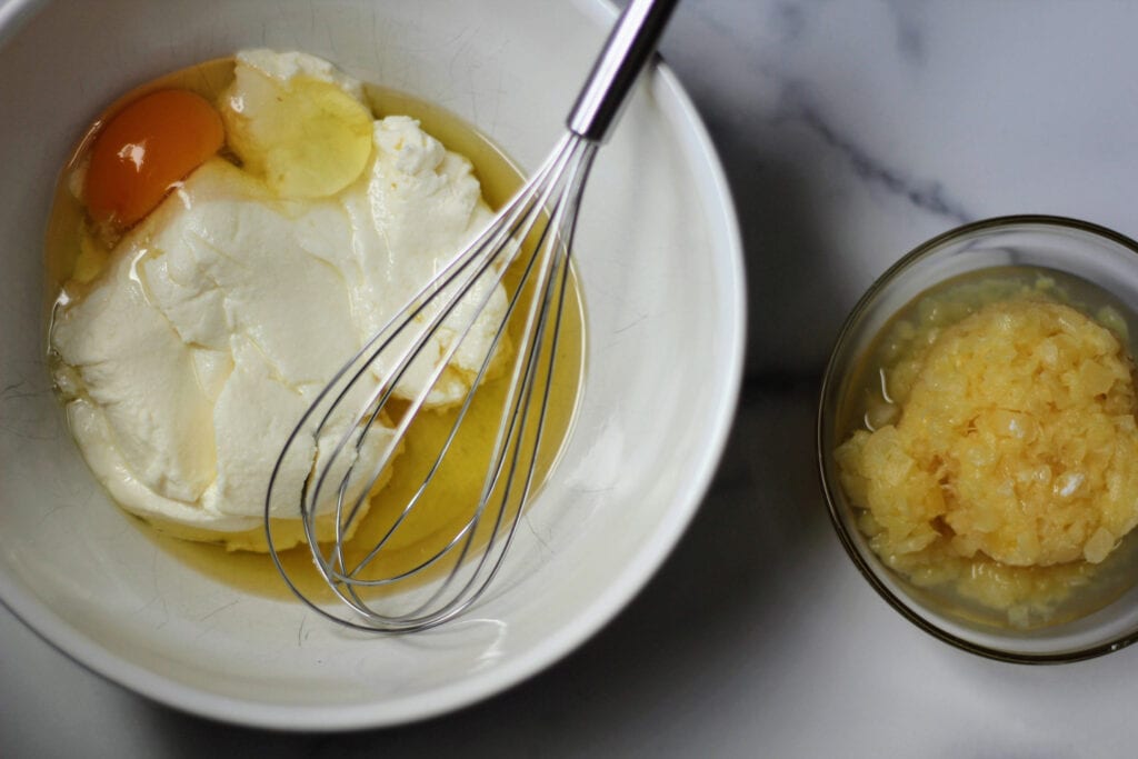 Whisk ricotta, egg, and oil until smooth