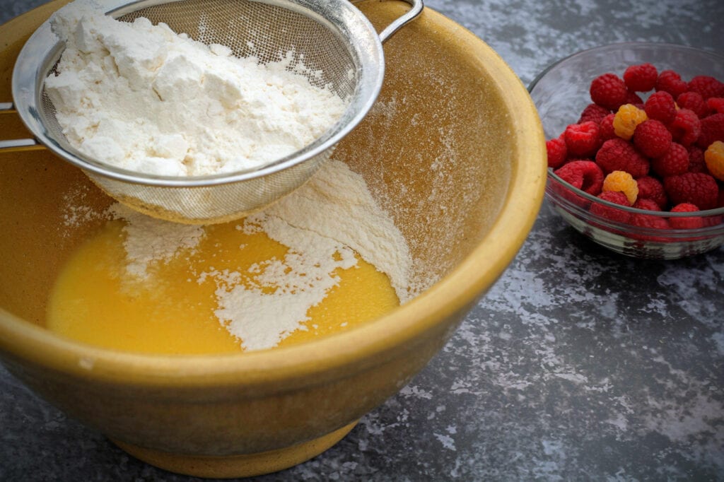 Sift flour, baking powder, and salt and fold into the yogurt mixture until well combined.