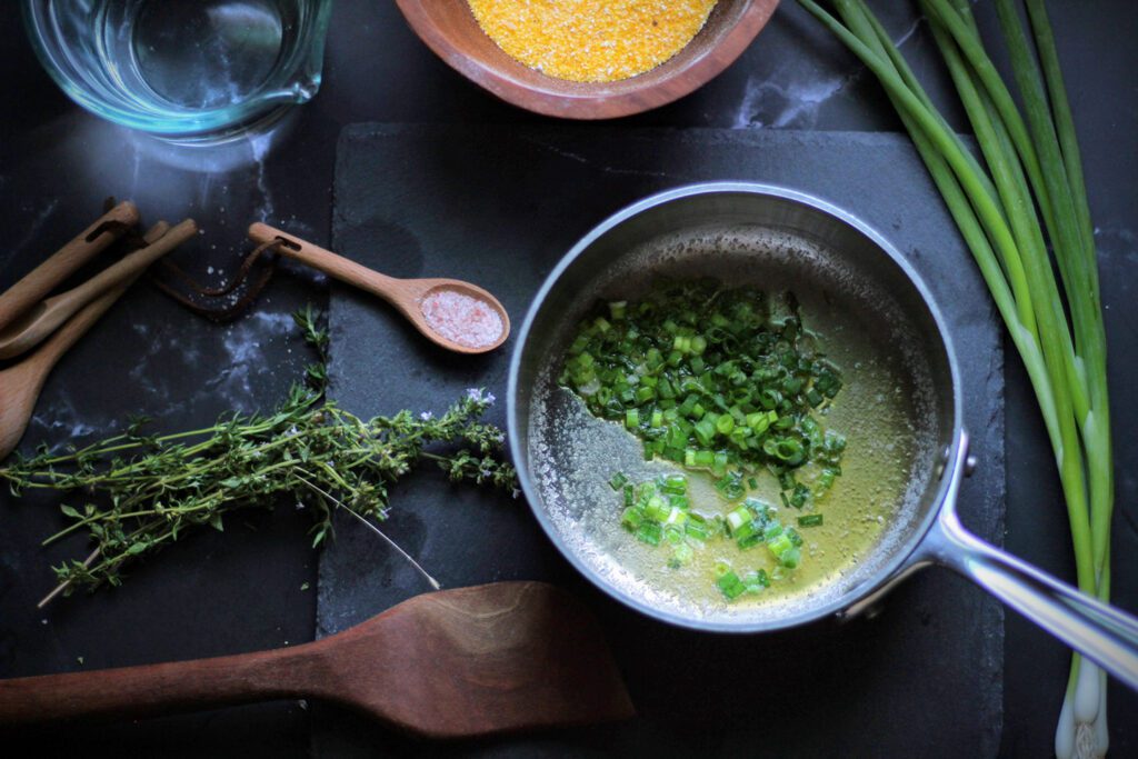 Wilt green onions in butter for about one minute