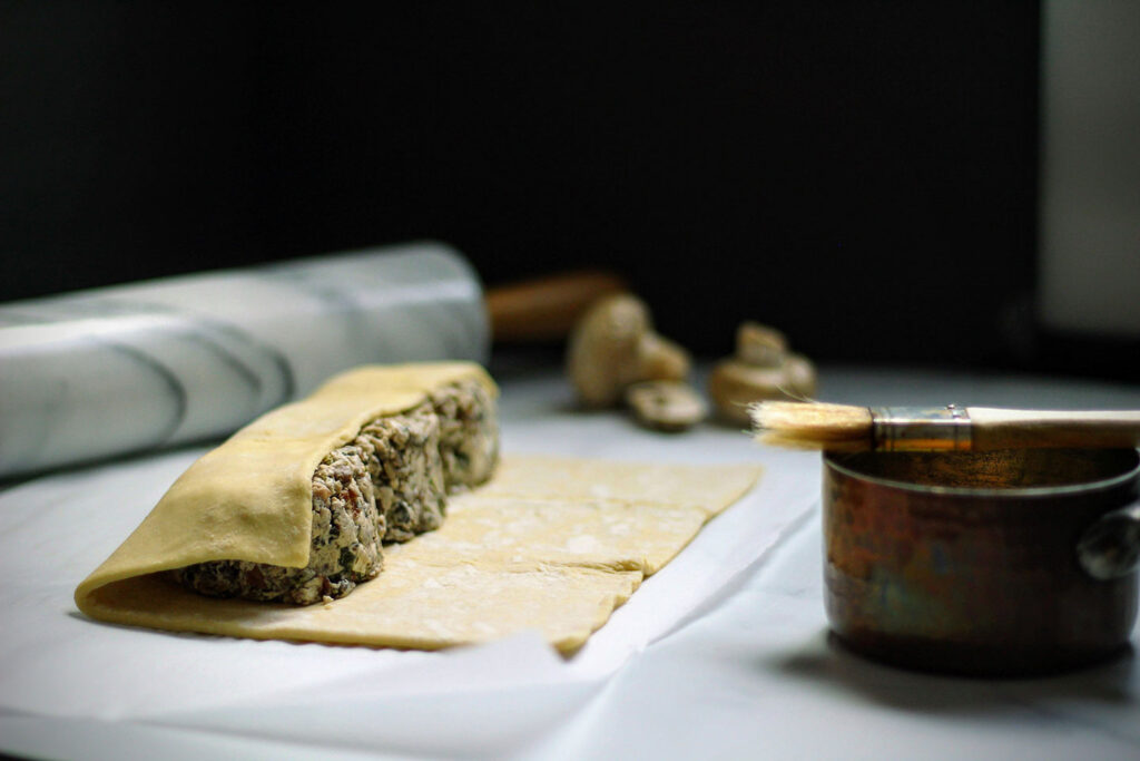 Place mushroom mixture down the center of each sheet, then fold over to create a rectangle.