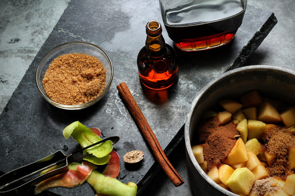 Cook apples and pears with brown sugar and spices, then add Grand Marnier and maple syrup and cook until fruit is tender.