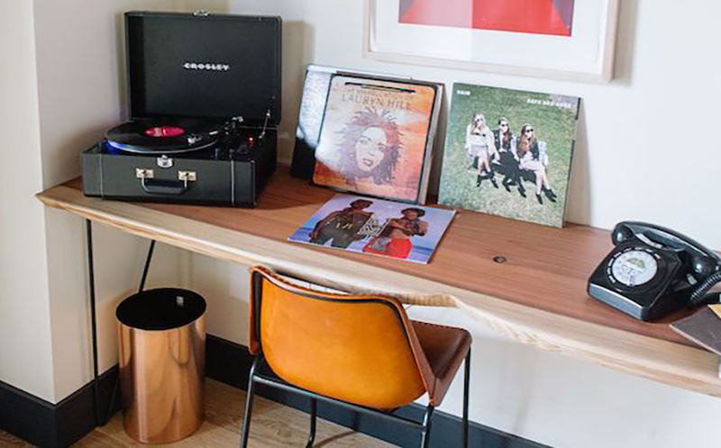 Crosley LP record players and vinyl records in the rooms at Timber Cove Resort