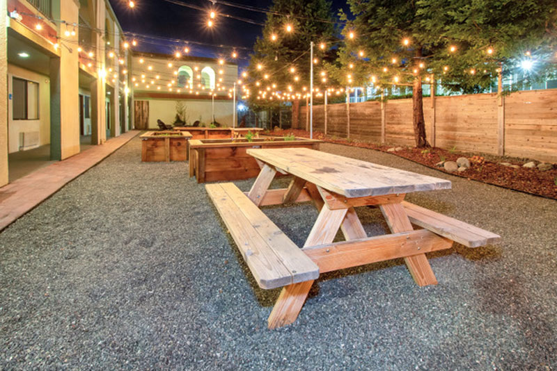 Outdoor courtyard at The Redwood Riverwalk