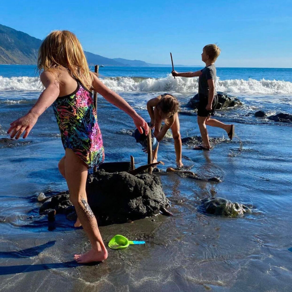 Kids playing on the beach near the Inn of the Lost Coast in Shelter Cove