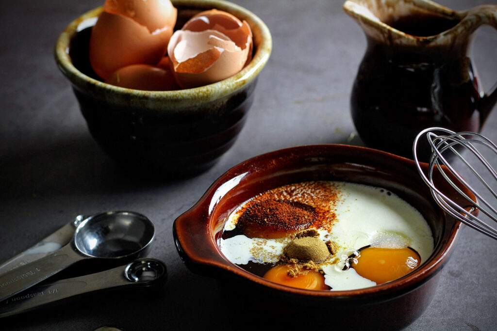 Whisk together eggs, cream, and dry spices.