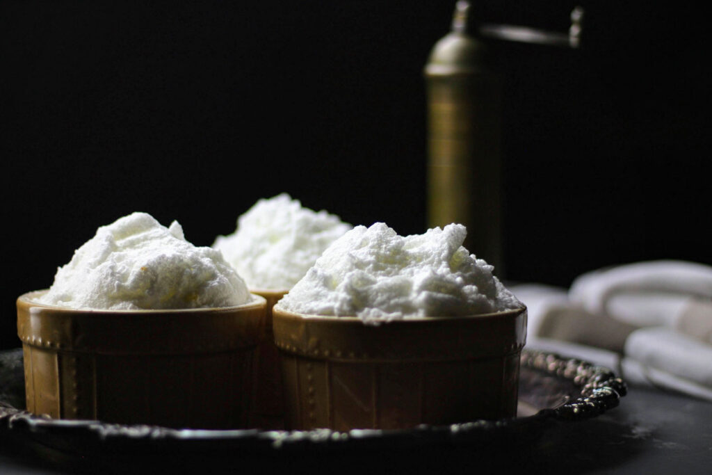 Top each ramekin with the remaining egg whites, forming a mound.