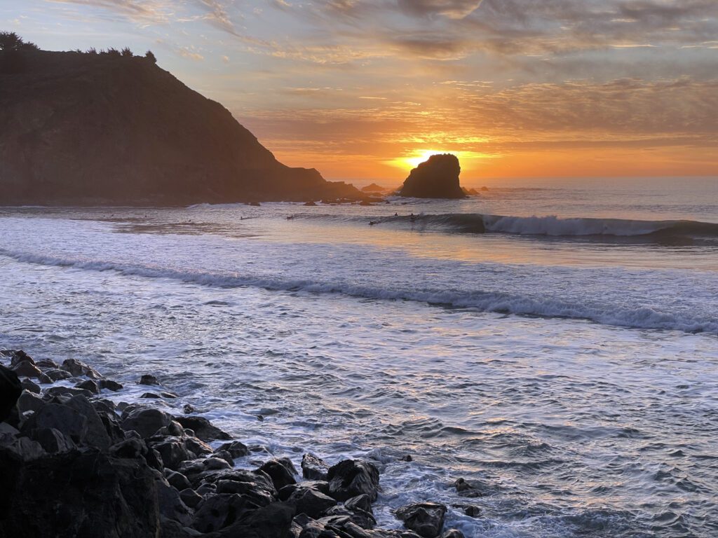 Surfers at sunset in Pacifica