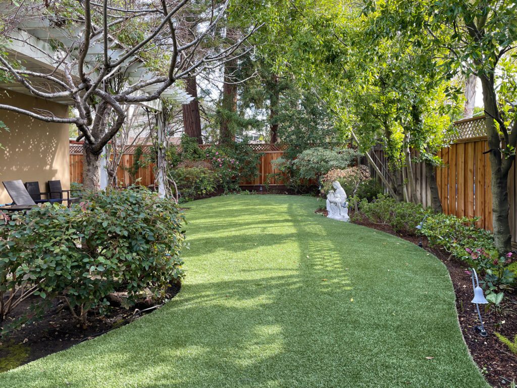 Backyard gardens and patio at Atherton Inn