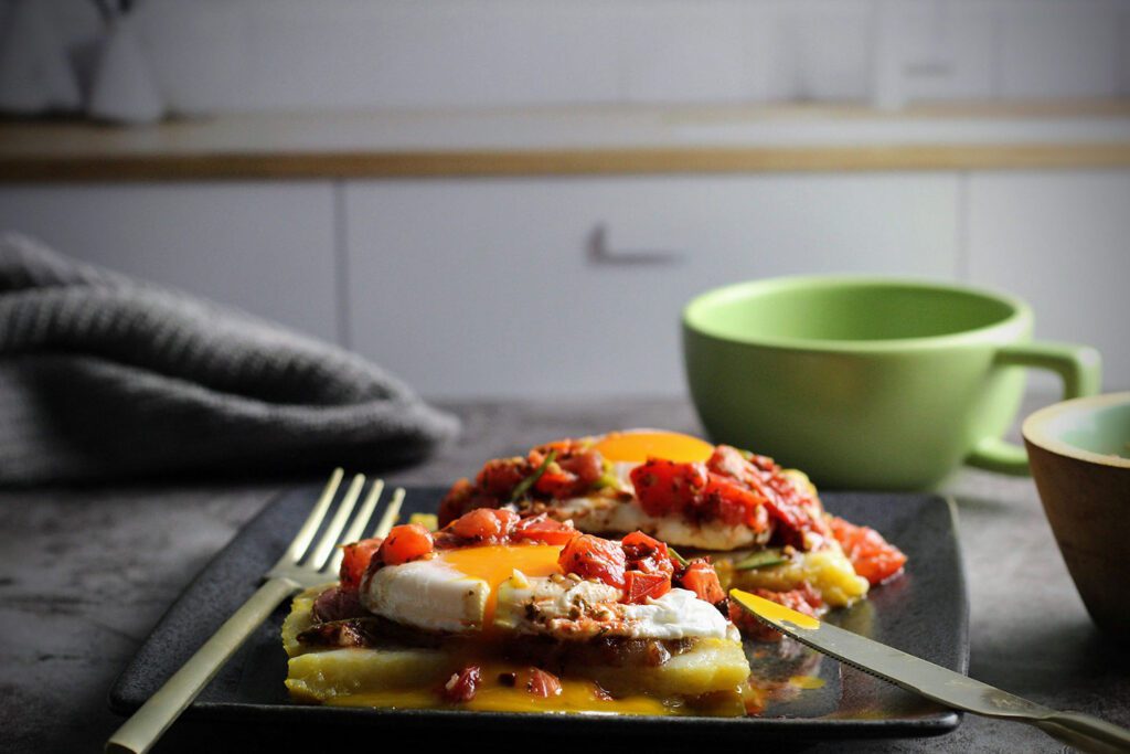 Side view of Poached Eggs on Polenta with Tomato Salsa