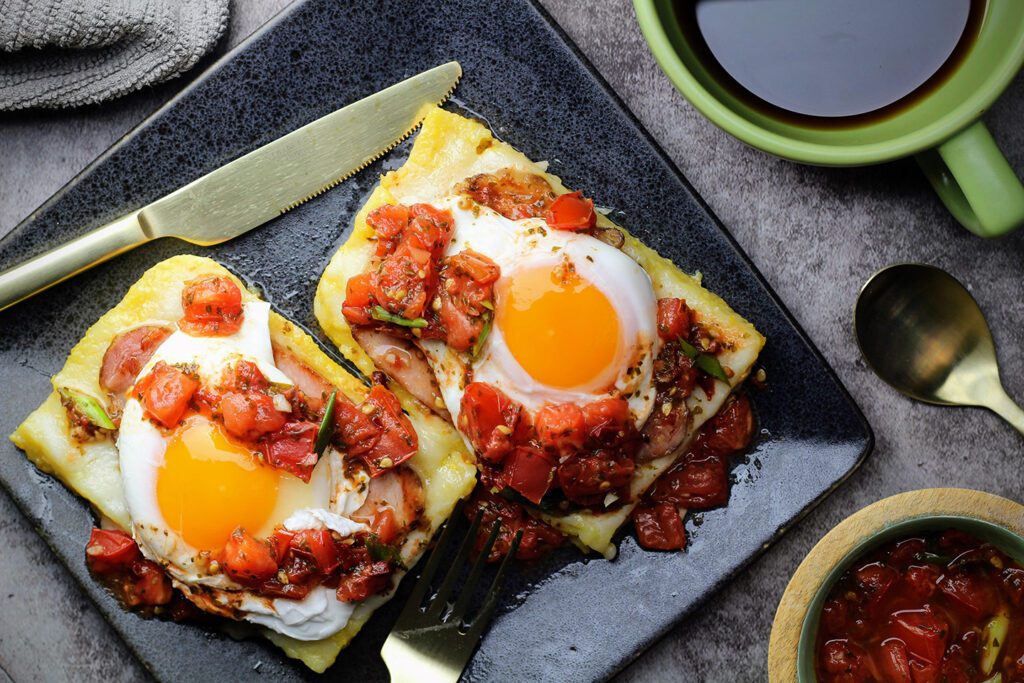 Top view of Poached Eggs on Polenta with Tomato Salsa