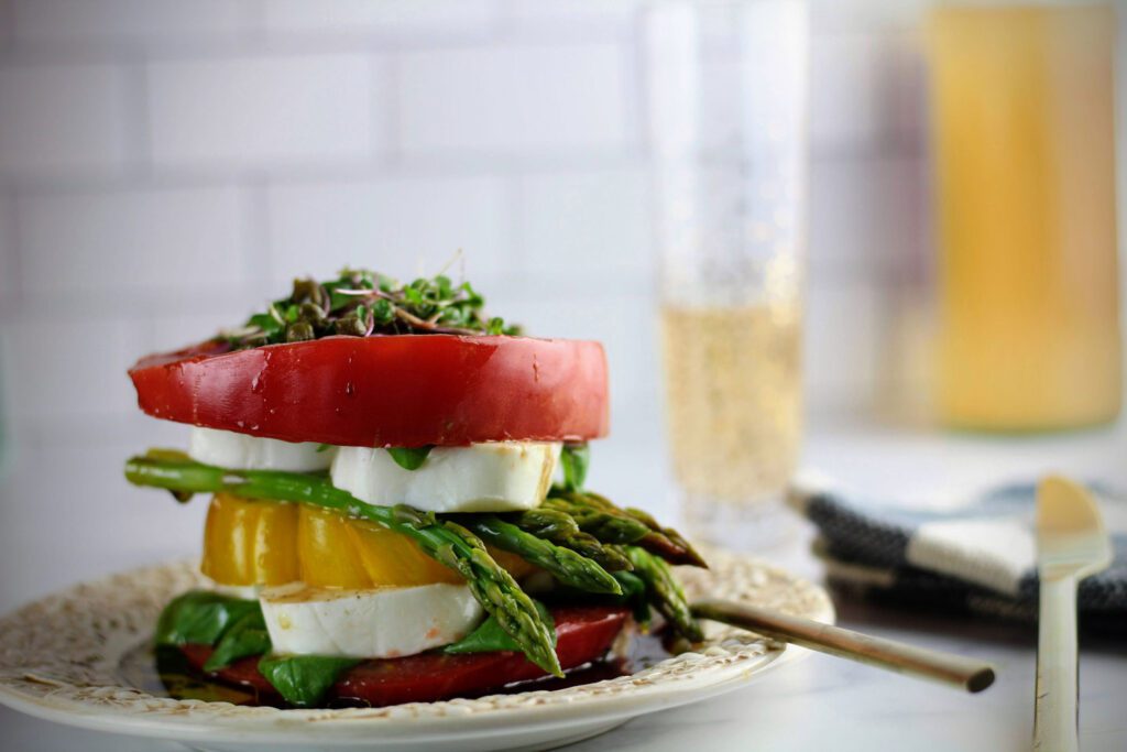 Stacked Caprese salad with asparagus