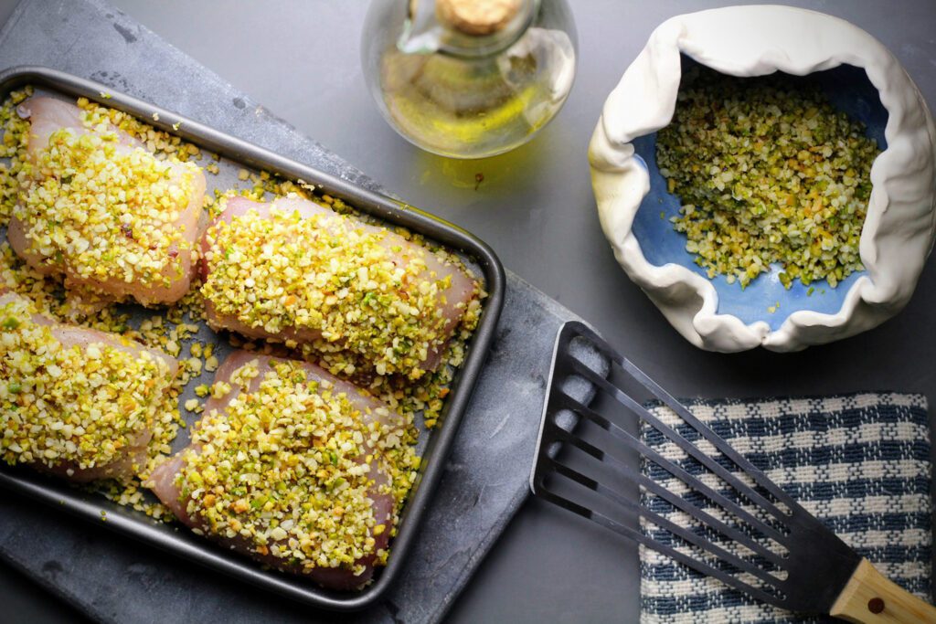 Top each cod filet with the pistachio-panko mixture to form a crust, then bake uncovered.