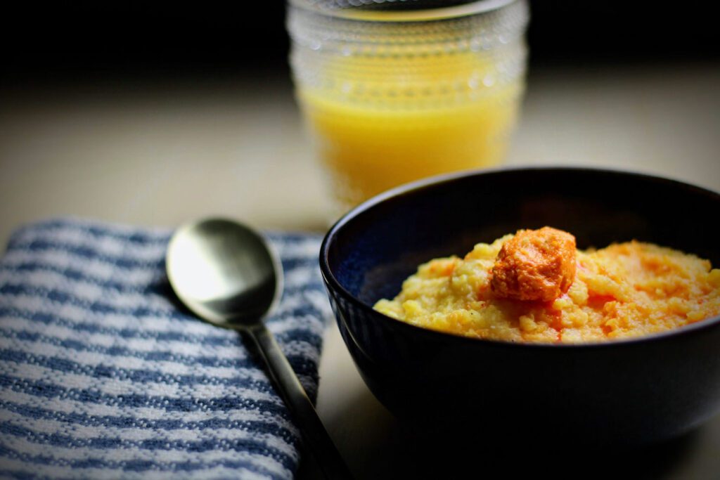 Fiscalini Cheddar Pimento Cheese served over grits