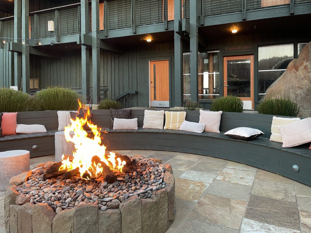 Fire pit in the outdoor living room at Timber Cove Resort