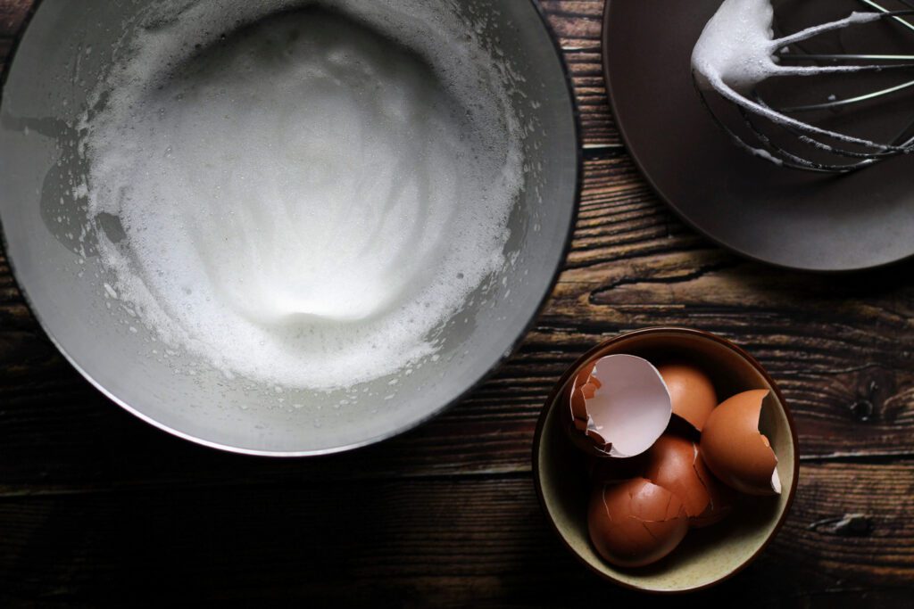Whip the egg whites until frothy.