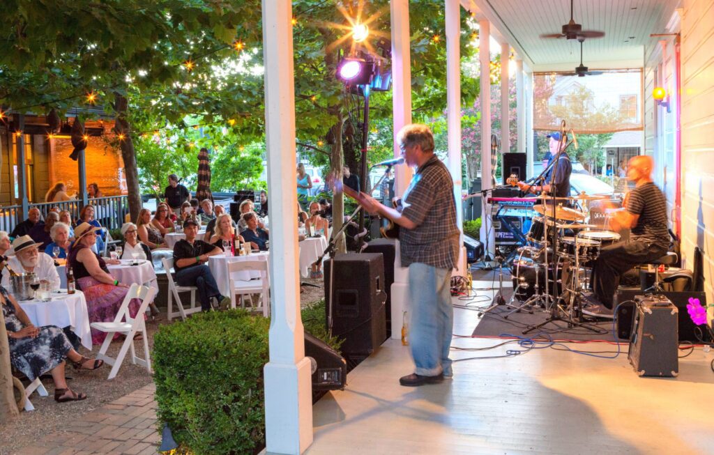 Outdoor dining and live music in the courtyard of the Tallman Hotel and Blue Wing Saloon