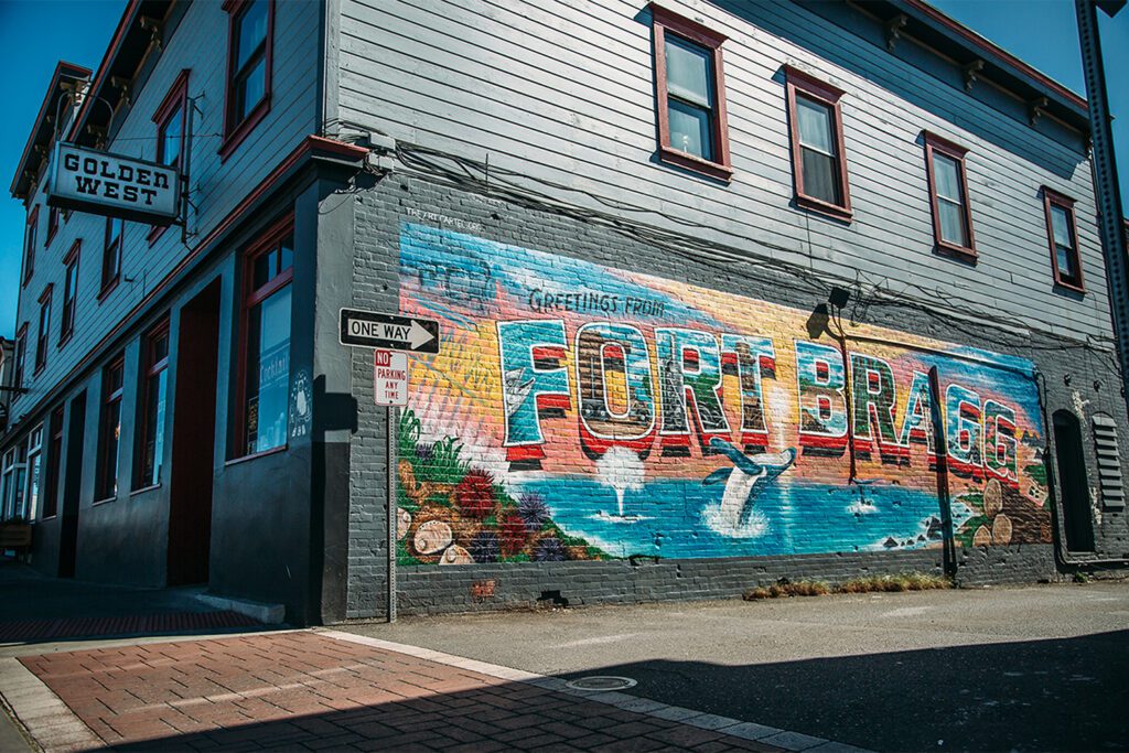 Exterior of Golden West Saloon with its "welcome to Fort Bragg" mural