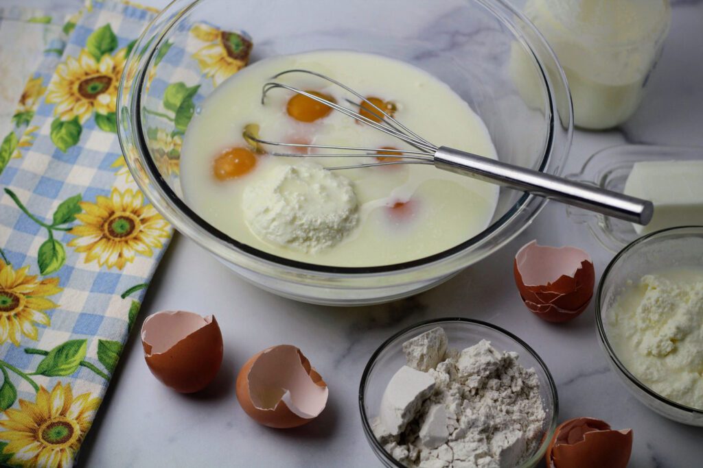 Blend eggs, milk, cottage cheese, butter, and flour until smooth.