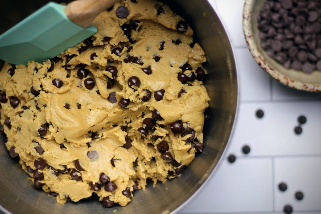 Folding the chocolate chips into the cookie dough.