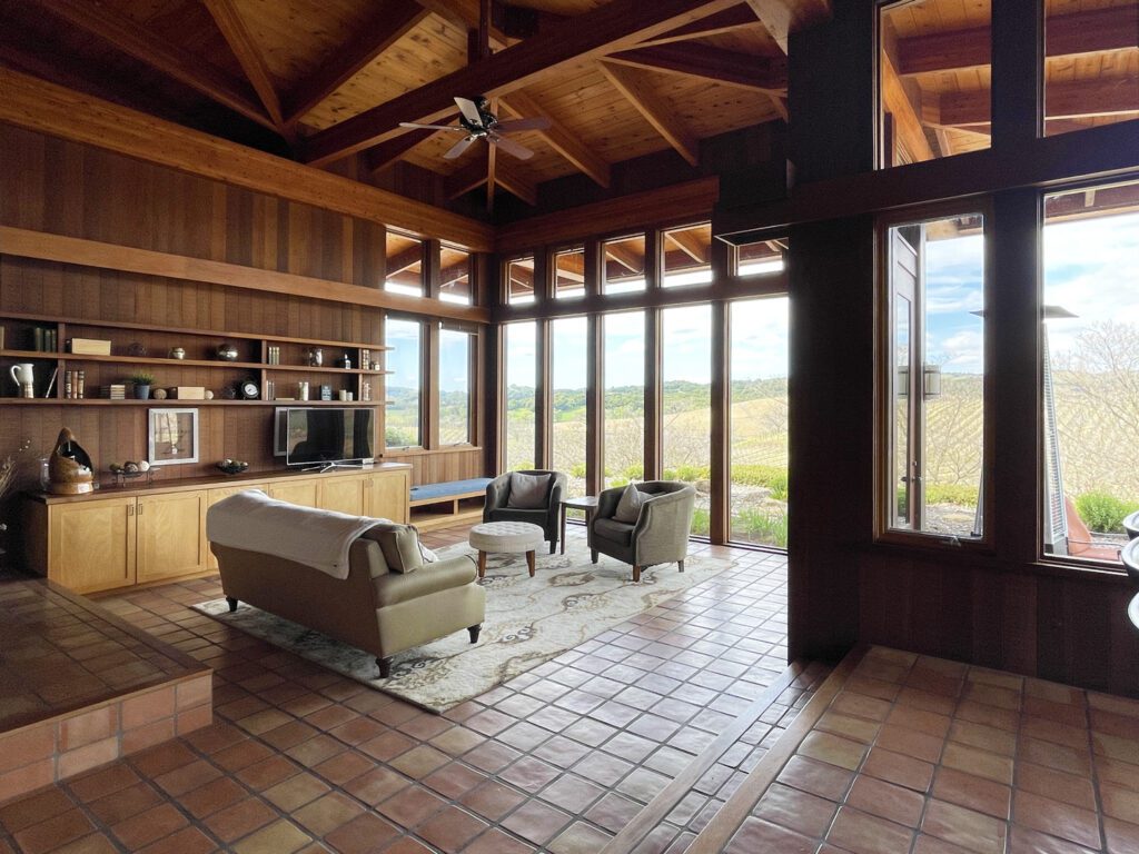 Living room with windows overlooking the vineyards.