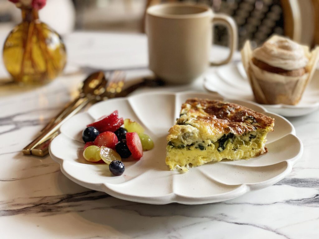 Frittata with side of fruit and a muffin