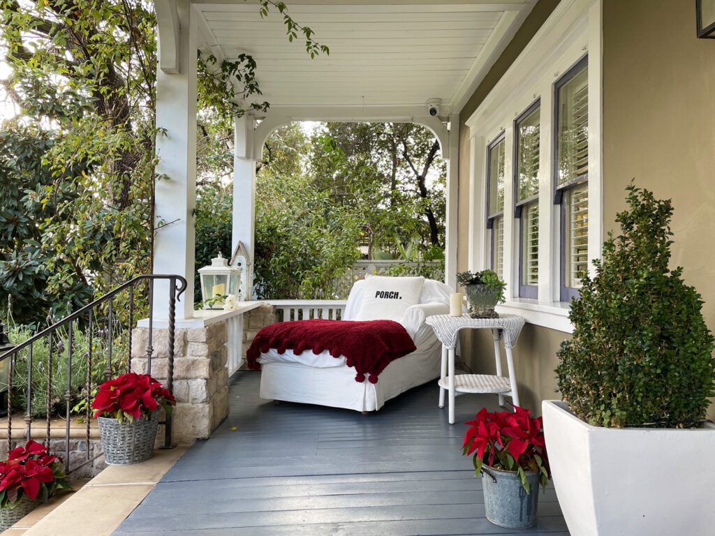 Front porch of the Lavender Inn decorated for the holidays