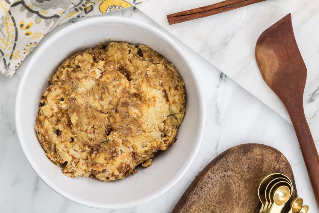 Sprinkle the brown sugar-cinnamon mixture over the dough. Knead in, leaving some streaks.