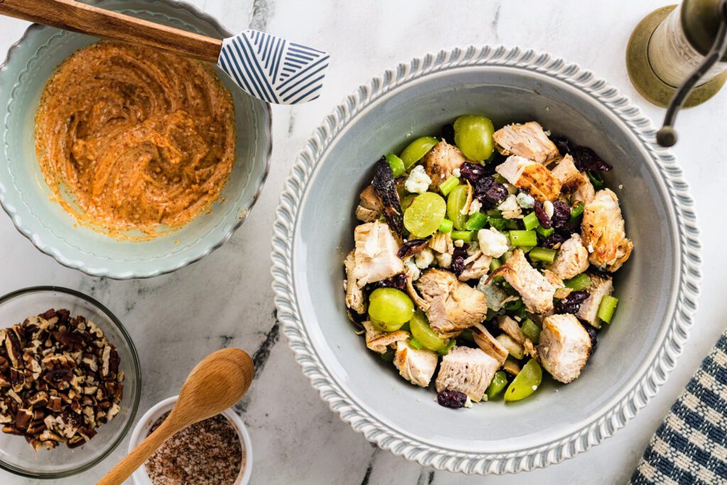 Combine the salad ingredients in one bowl and the dressing ingredients in another.