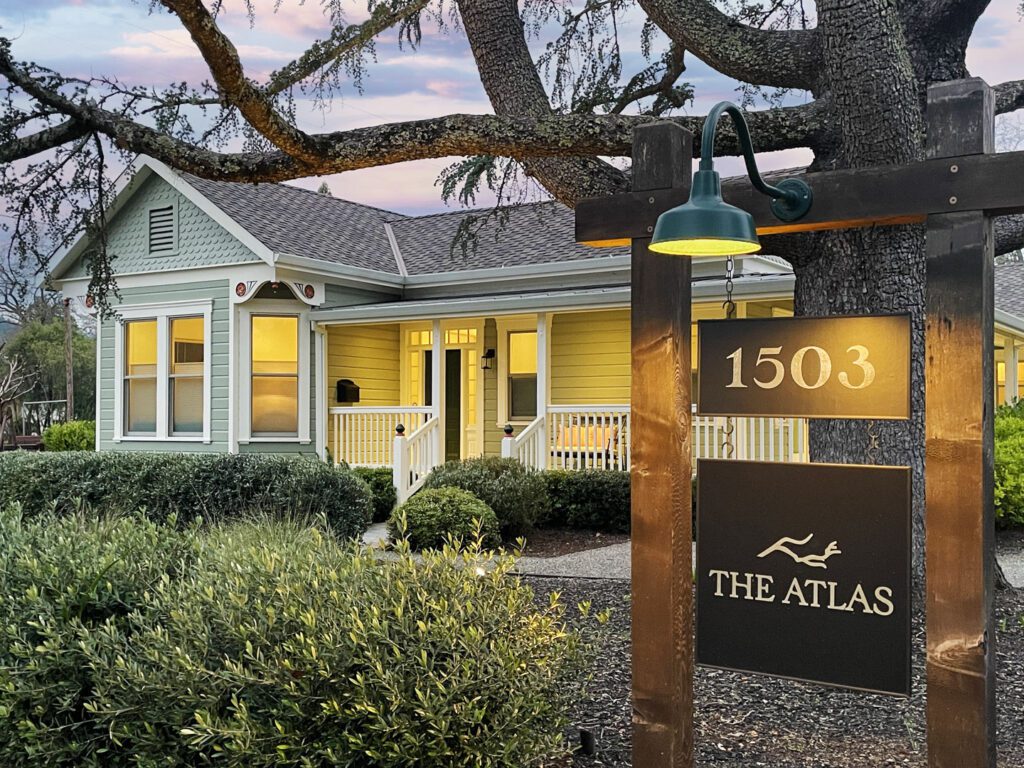 Exterior of The Atlas main house at dusk