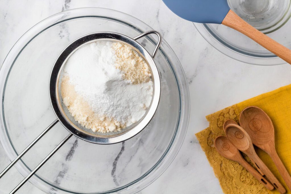 Sifting dry ingredients into a bowl