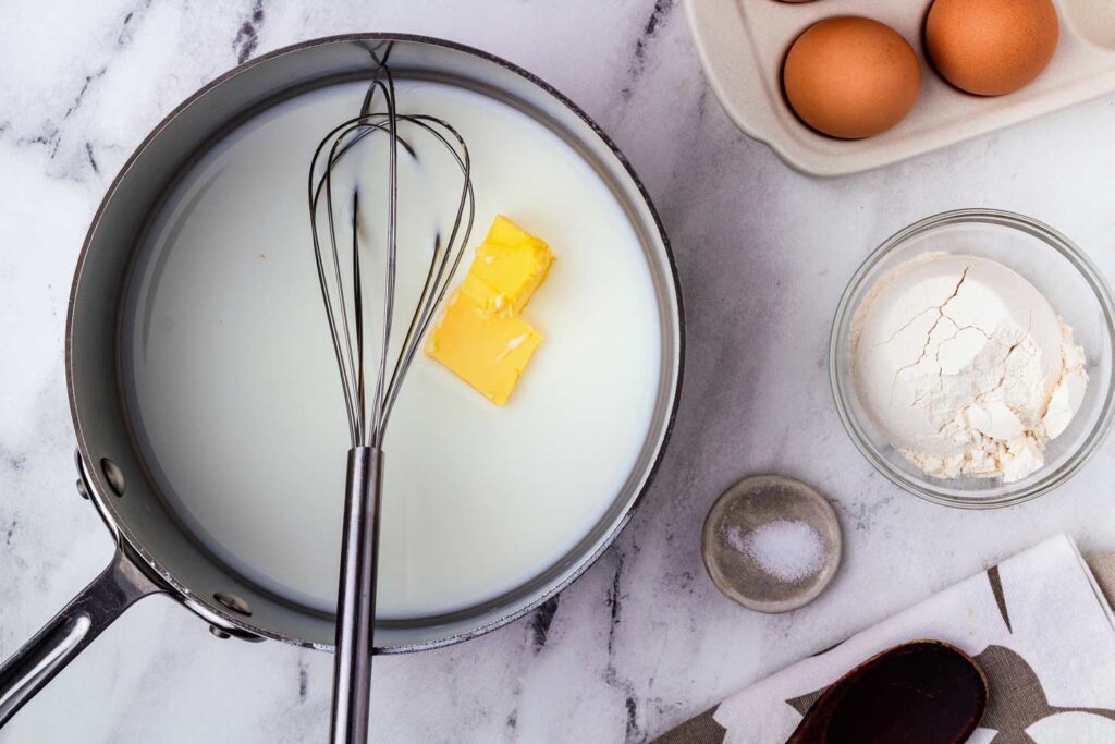 Whisk milk, butter, and salt in a pan