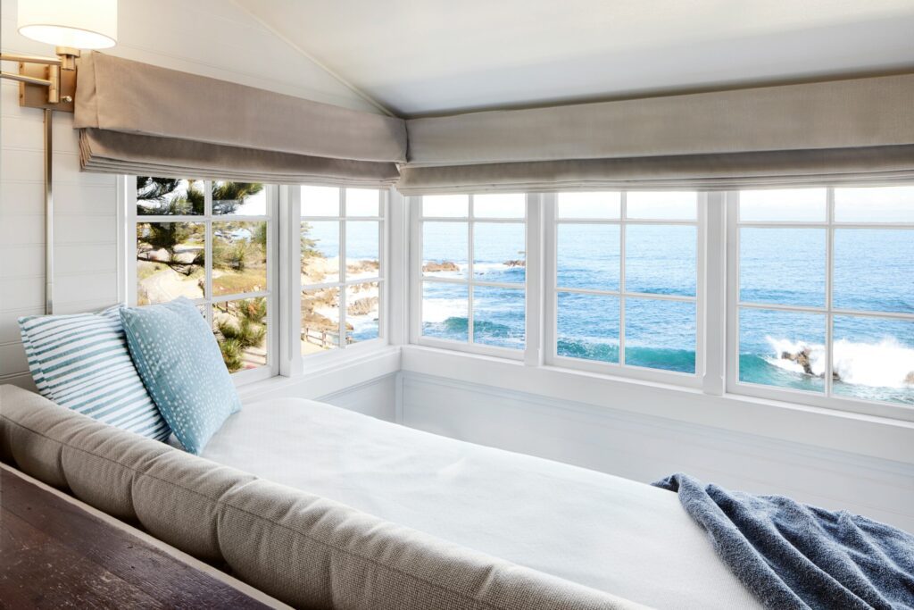 The Balcony Room at the Green Gables Inn with a cozy daybed and ocean views.