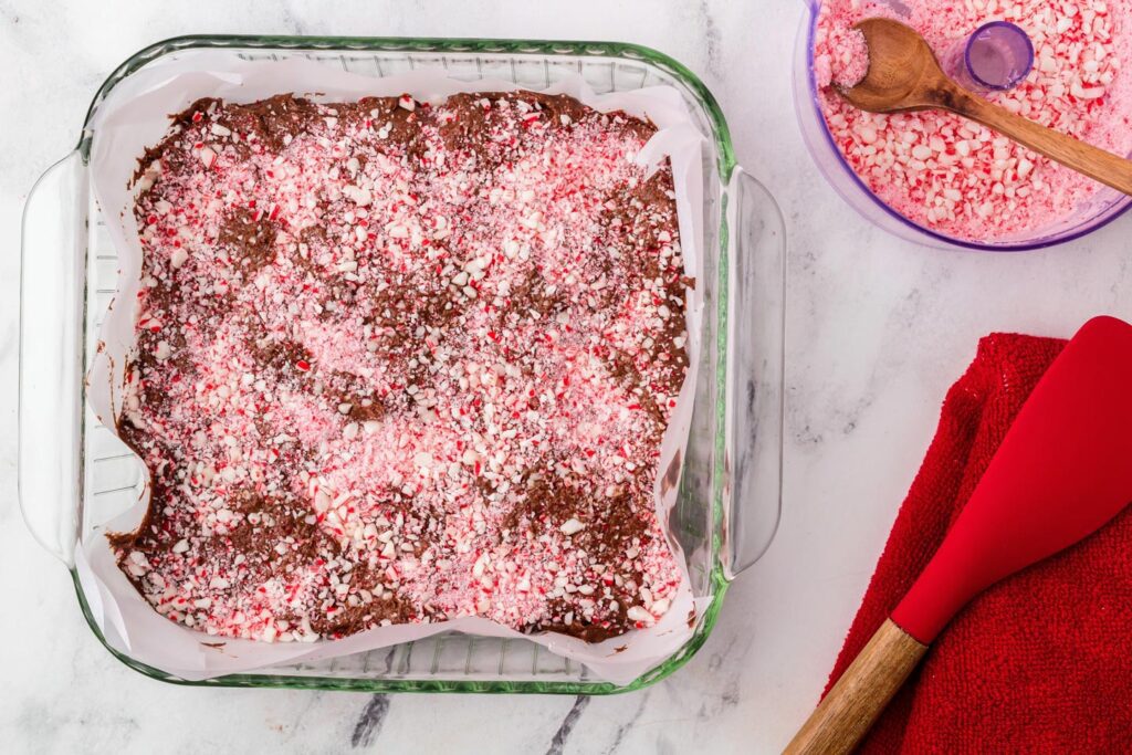 Crushed peppermint srinkled atop the brownie batter